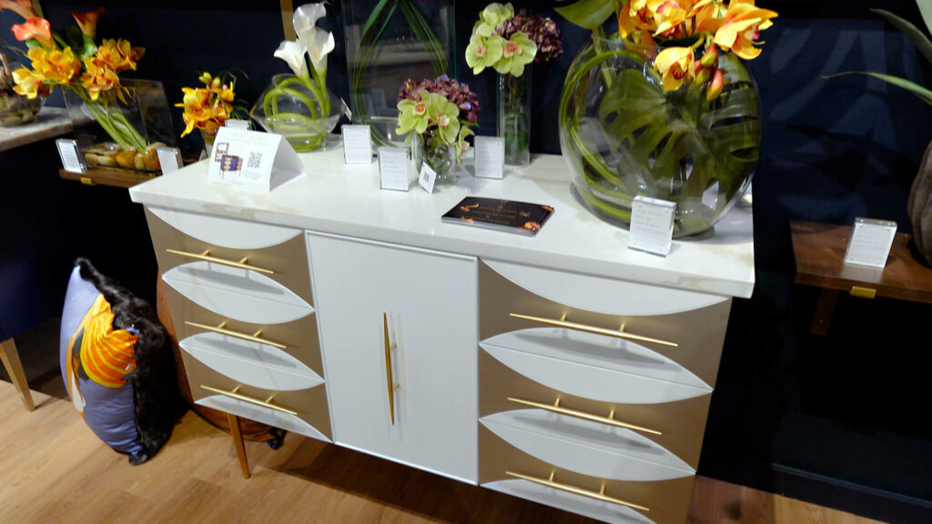 Image: white and gold modern bath vanity, Ikebana style floral arrangements, silk pillow