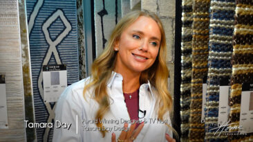 Image: blonde smiling woman Tamara Day in button down white shirt standing in rug showroom