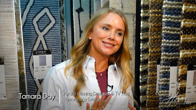 Image: blonde smiling woman Tamara Day in button down white shirt standing in rug showroom