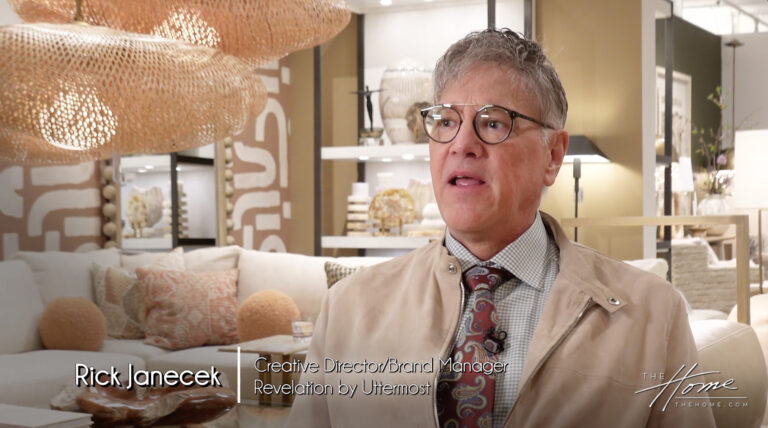 Image: man with glasses, tan jacket, tie, checkered shirt in furniture showroom, peach pillows and white couch. Text: Rick Janecek, Creative Director/Brand Manager, Revelation by Uttermost
