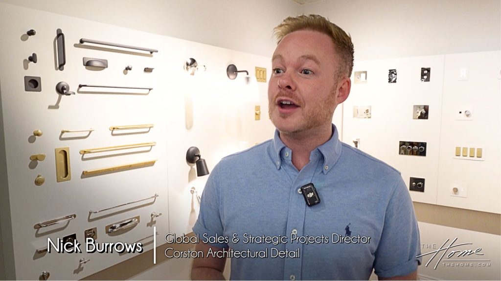 Corston Architectural Details showroom with man in blue shirt standing and talking